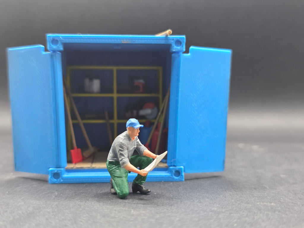 Arbeiter auf einem Knie mit einem Plan in der Hand im Maßstab 1/50 Hand Bemalt